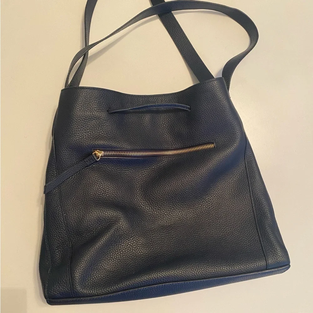 LAGGO || Andrea Tassel Drawstring Hobo Bag Pockets Pebbled Leather Navy‎